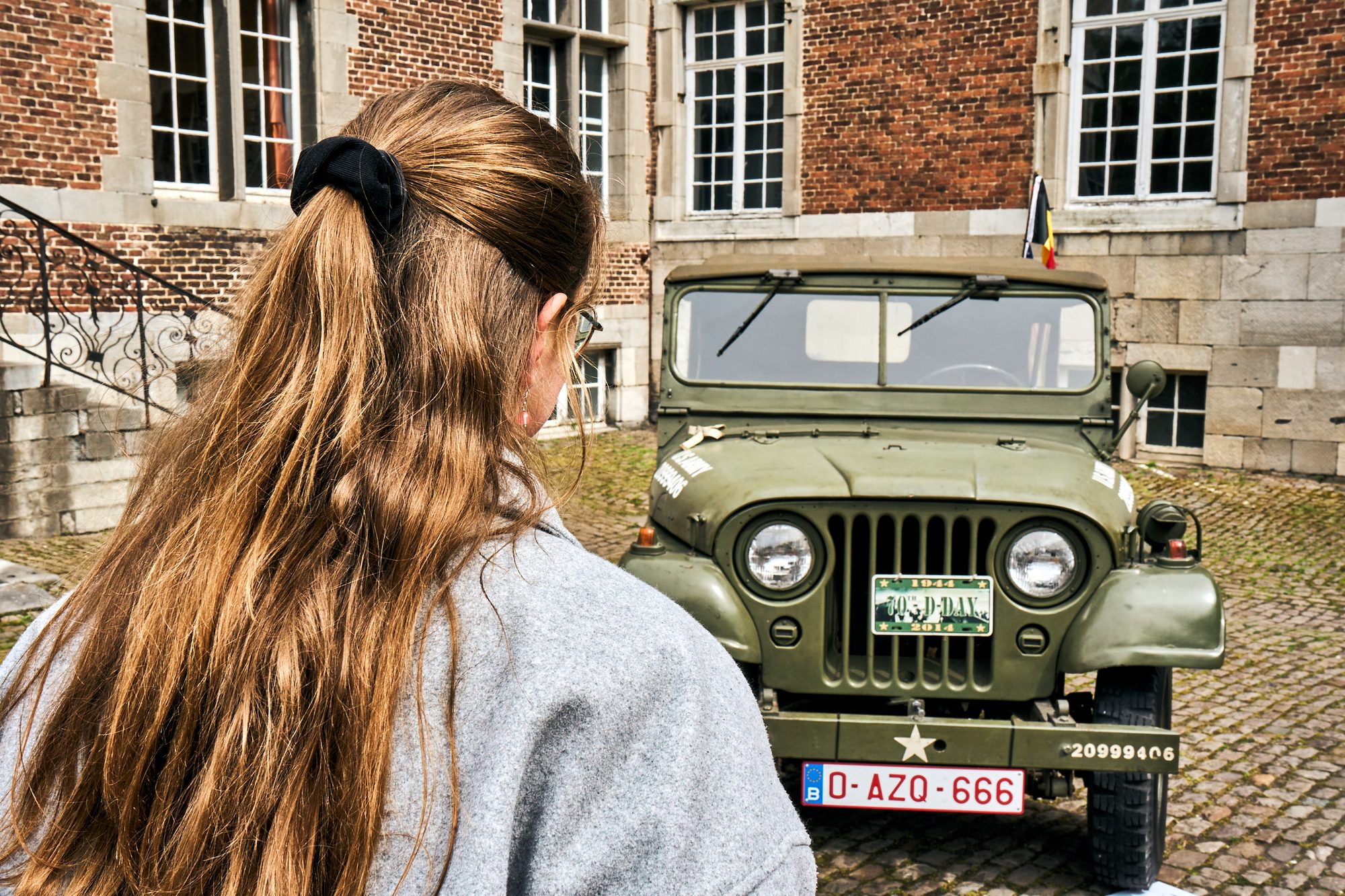 Looking back — girl and the military jeep